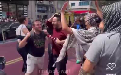 A man assaults a woman at a protest in NYC. 