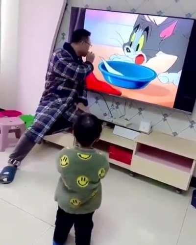 Dad showcasing his magic skills to his son