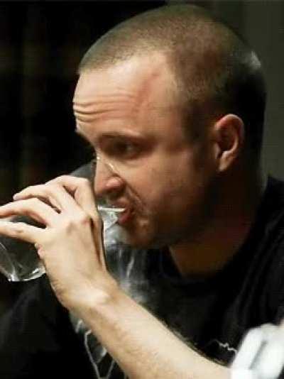 Jesse Pinkman drinking a glass of water