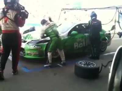 V8 Supercars mechanic elbow drops a car bonnet to repair it