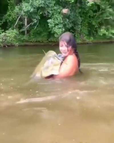 She is fishing with her dad.