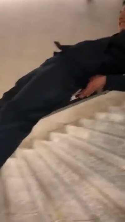 To slide down a public stairway