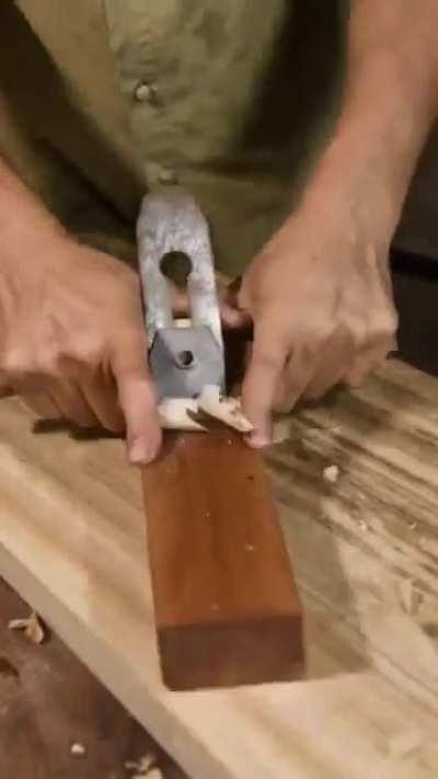 Skilled woodworker doesn't let a piece of rotten wood from the outside go to waste. He uses it to incorporate it into a hand crafted piece of furniture. He also builds it without the use of a single nail in the process.