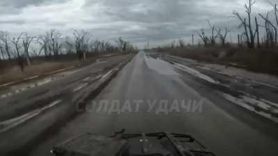 Russian soldiers on a quad bike avoid a Ukrainian FPV drone that was chasing them