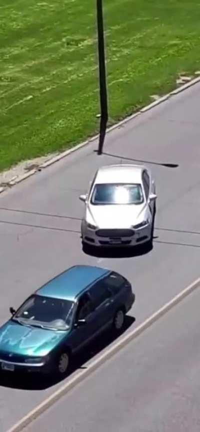 Dude throws rocks at car, instantly regrets it