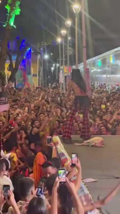 Stray Caramel dog falls asleep on stage during Carnaval show on Recife, Brazil