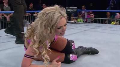 Taya leg drops Allie in the crotch