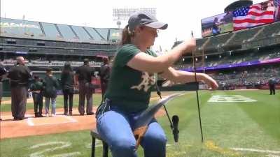 Caroline McCaskey playing the US National Anthem on Saw before a Baseball Game