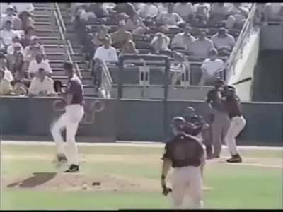 Randy Johnson kills a bird while pitching a baseball, circa March 2001