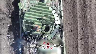 Ukrainian drones destroy a Russian T-72B3 obr. 2022 by Tonenke. April 2024 (music from source) (at 48.1472, 37.6006)