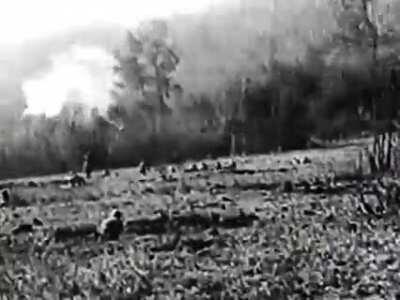 WW1 German 'bombers' attack an Allied trench; cameraman killed (no gore SFW) year unknown. Sound effects added in editing early 1930s