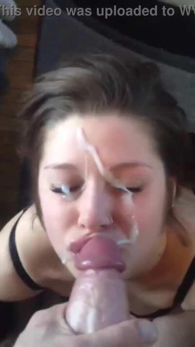 Pigtailed teen gets facial from huge cock