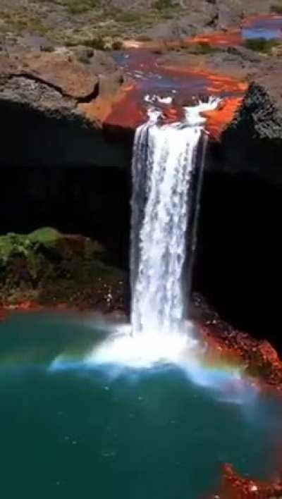 Salto del Agrio, Agrio Falls is a cascade about 60 meters high, which drops to a small green pool surrounded by yellow and red basaltic rocks. This colourful contrast and the trees called araucarias that surround the region make this waterfall really char