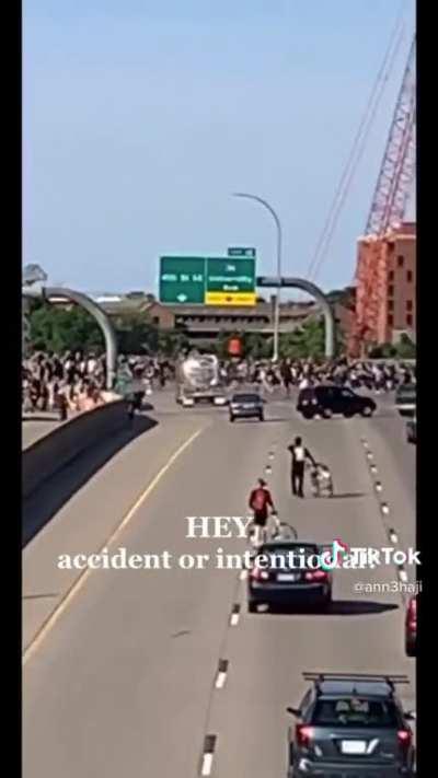 Protesters fill an interstate highway as gasoline tanker barrels through crowd