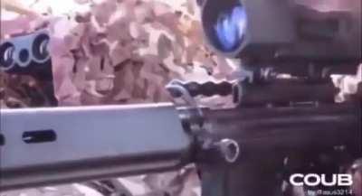 Sniper hits a terrific shot on unsuspecting soldier on the phone