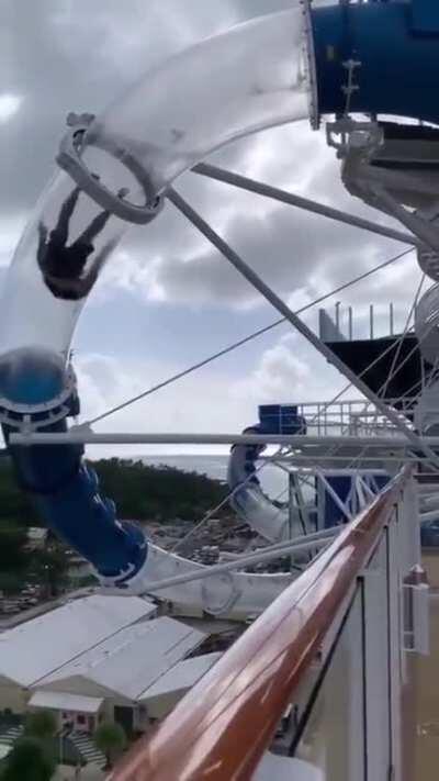 Man needs more speed on a water slide.