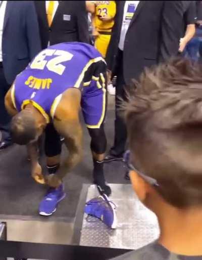 LeBron James gives kid game worn shoes after the lakers break the assist record