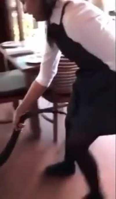 Evil waitress uses lizard to vacuum the floor