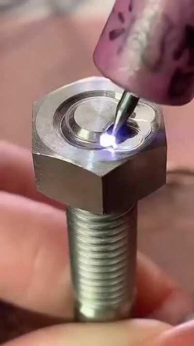 Argon arc welding a bolt