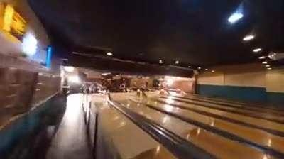 Drone footage through bowling alley in one take.