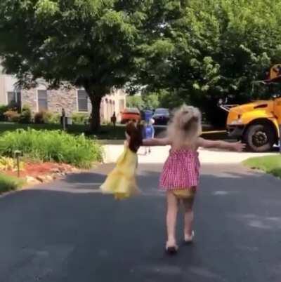 Little girl so excited for her brother to arrive home from school. Waits outside everyday