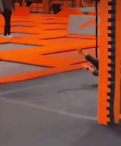 Excited kid confused by “invisible wall” at trampoline centre.