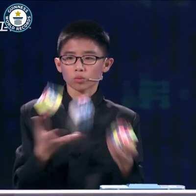 Fastest Time To Solve Three Rubik's Cubes Whilst Juggling