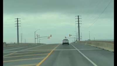 Tow truck driver runs a red light with a near miss 