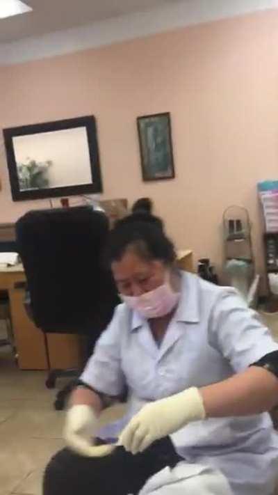 Guy laughs while getting a pedicure