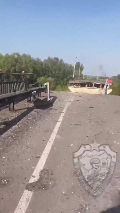 Ukrainian troops observe what’s left of the bridge over the Seym River near Glushkove - August 2024