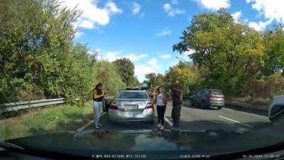 Driver backs up into a car to make it look like they had been rear-ended, passengers get out and act like their necks were injured. 