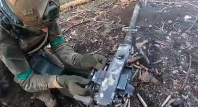 Ukranian using a Dushka 12.7x108mm to lay down suppressive fire in the Kreminna forest 