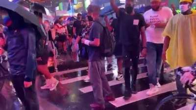 Vehicle plowing through protesters in Times Square.