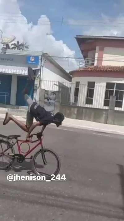 Dude gets folded off his bike