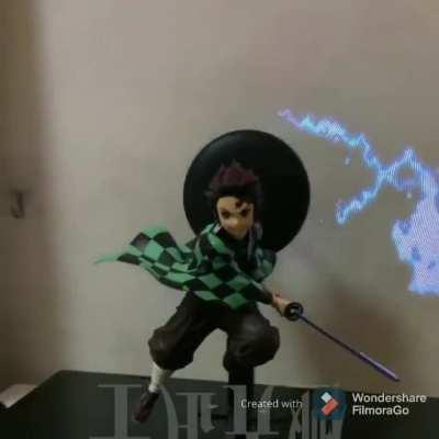 This Demon Slayer figure has an animating background