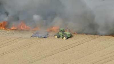 A farmer (Eric Howard) trying to save a field from fire in Weld County, Colorado. Eric is actually the neighbour of the farmer who owns the field. Once alarmed, he ran home and grabbed his equipment to help out.