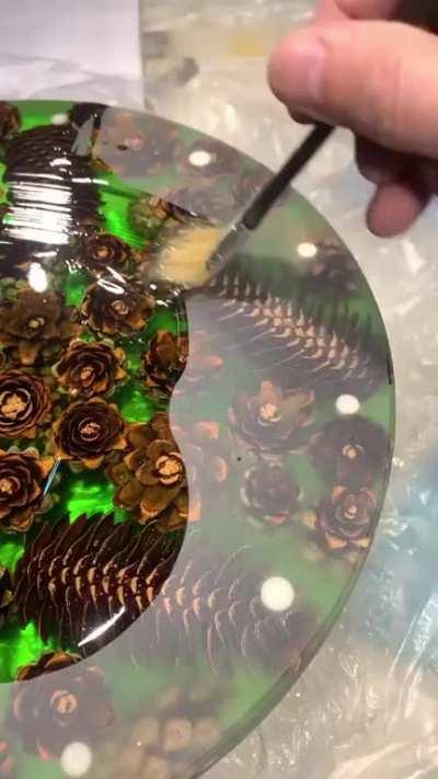 Epoxy resin coffee table with pine cones