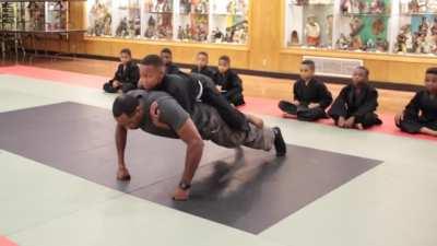 Martial arts instructor teaches young student mental fortitude &amp;amp; how to break through emotional barriers during training