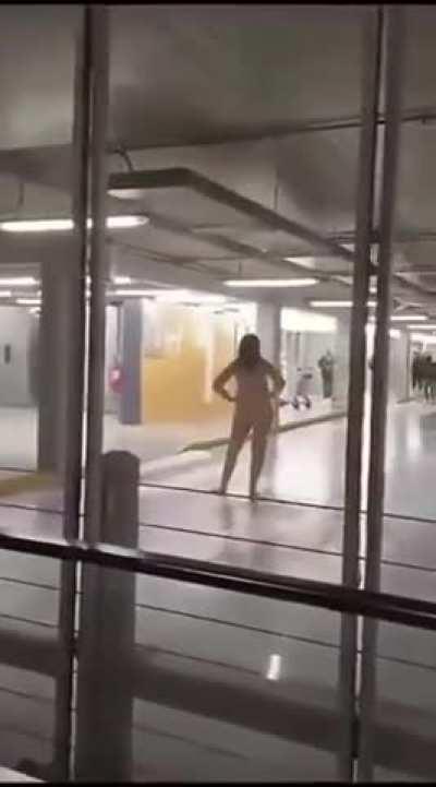 Naked woman harassing people at the airport