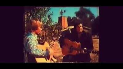 John Denver and Johnny Cash singing country roads together