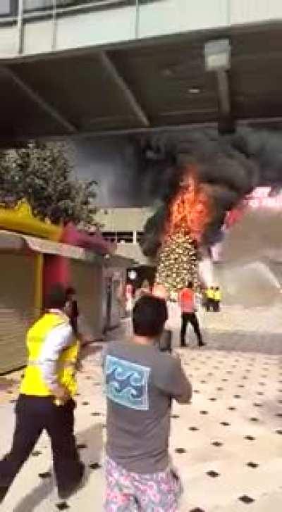 Xmas tree engulfed in flames. Jockey Plaza Shopping Centre. Lima, Peru