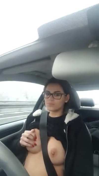 Beautiful Girl Playing with Her Tits While Driving