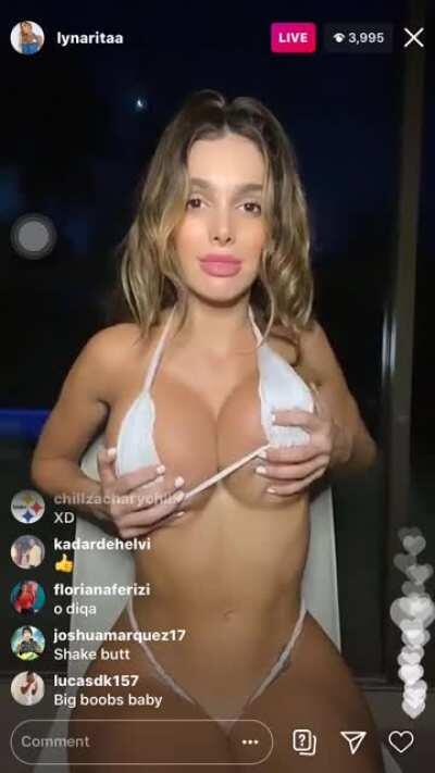 Playing with her boobs