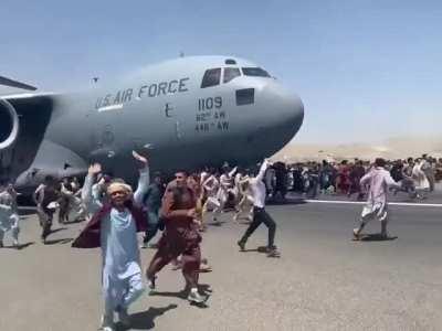 Locals cling to US Air Force plane as it takes off in Kabul