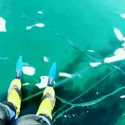 Alien-like chatter of the world’s deepest lake as photographer shares eerie sounds of newly-formed ice. Alexey Kolganov films himself skating on transparent ice of lake Baikal, as new cracks form under his skates