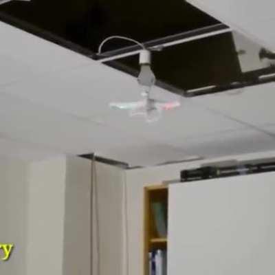 Using a drone to screw in a light bulb: