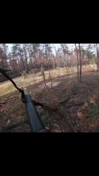 A Ukrainian solider firing off multiple RPG-7 rounds towards Russian positions in a forest. Not sure on the exact location but my guess would be the Luhansk Oblast.