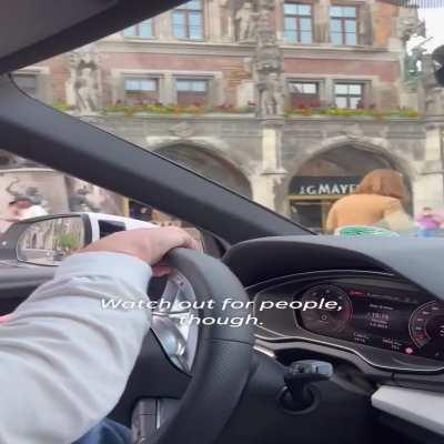 American tourists drive through pedestrian area in Munich