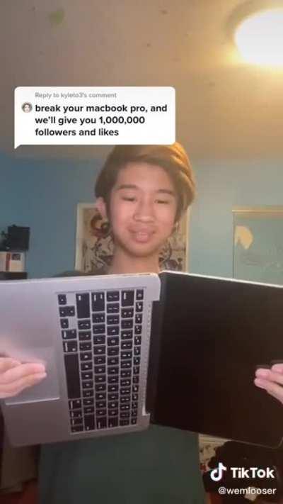 Kid breaking MacBook for likes