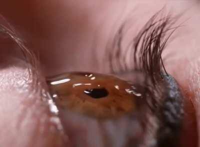 Close up eye drop in slow motion